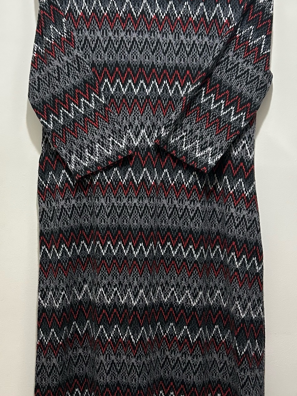 Stylish Cato dress featuring a zig zag print in black, gray, white and burgundy